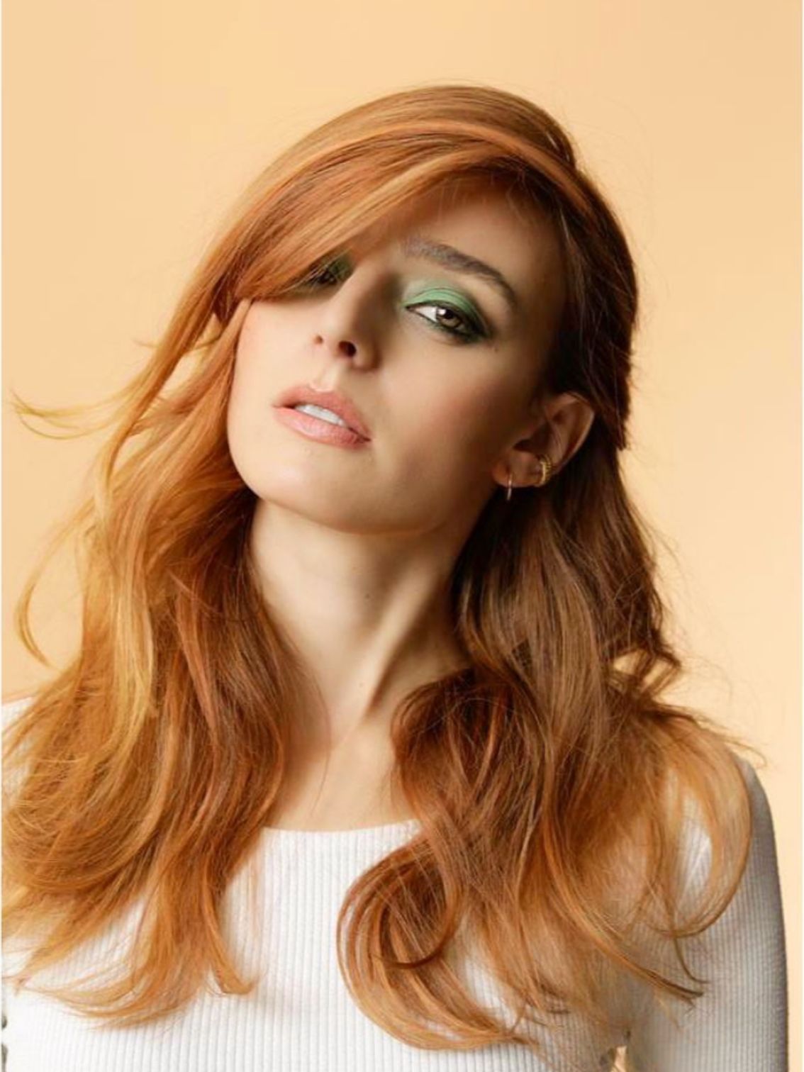 model with dimensional copper hair color