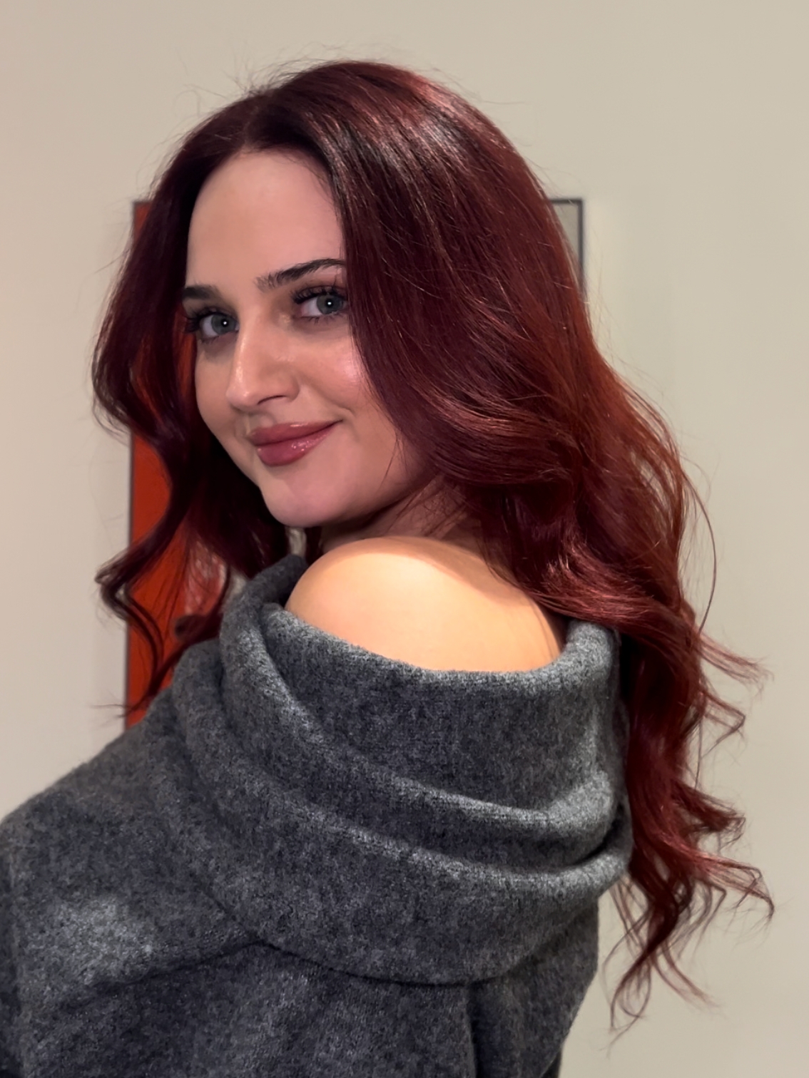 Image of a woman with long, deep burgundy hair